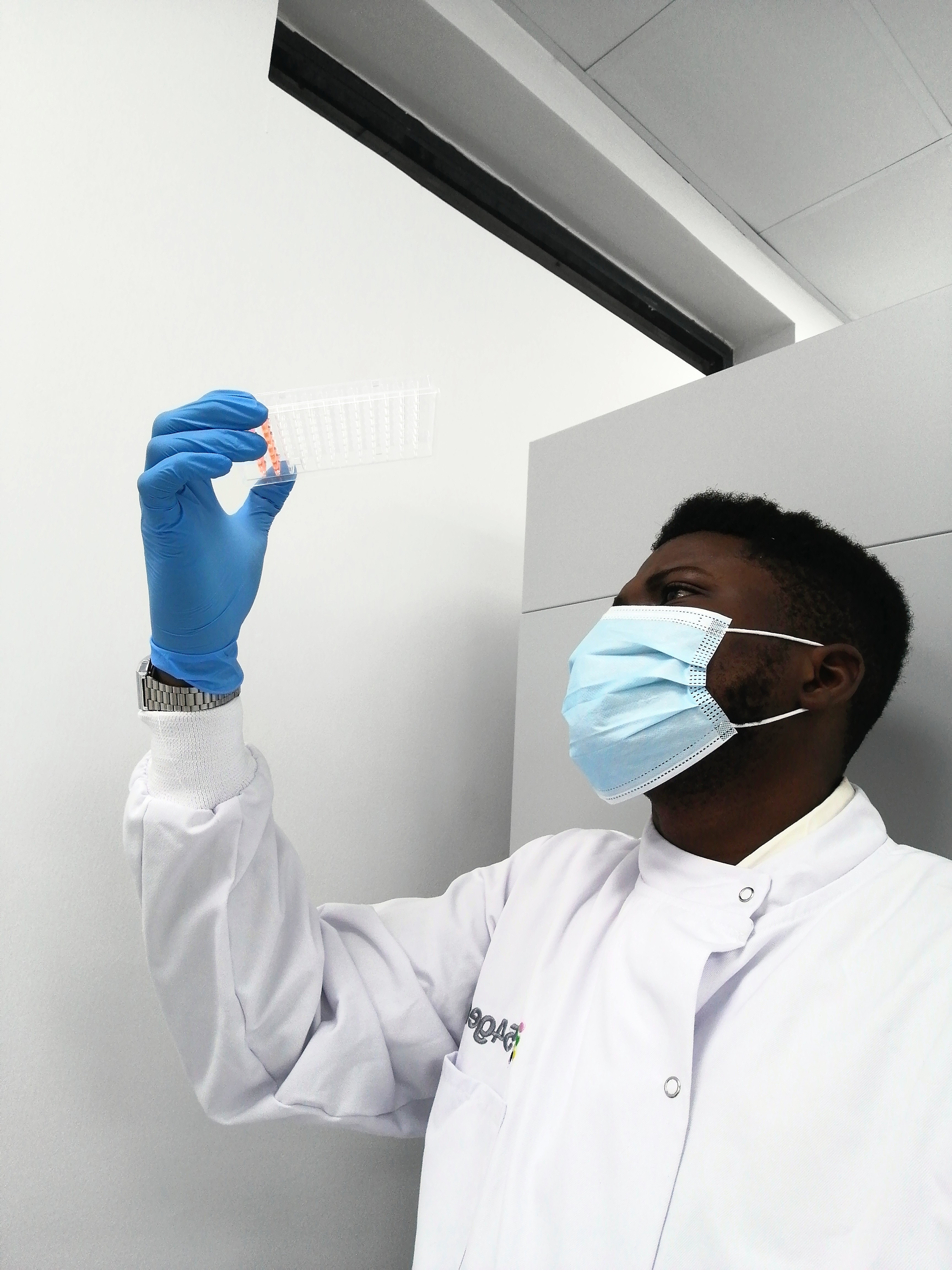 Kehinde “Kenny” Adebiyi wearing a white shirt